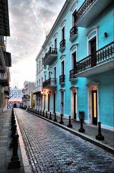 Old San Juan, Puerto Rico.  Antique shops, delightful caribbean paintings, colorful downtown.  If you dare (windy mountain road, Puerto Rican drivers behind you :), drive to the Areceibo radiotelescope -- it's amazing! Beautiful place!