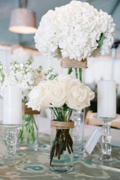 Love this. Could have each bridesmaid have a bouquet of different white flowers and bride have some of each bridesmaid flower type! White hydrangea and rose wedding bouquets...