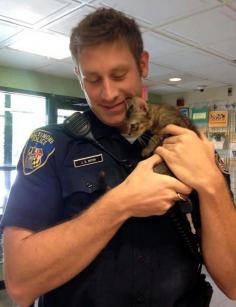 Police officers love cats: Officer Boyer rescued this kitty twice. First when he came to the aid of a stray kitten and again, a few hours later, when he adopted him.