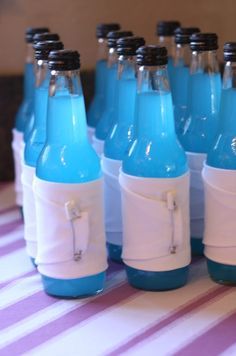 
                    
                        Sodas in the color scheme of the baby shower are wrapped some fabric,  then pinned with some diaper pins.  Adorable! (My favorite flavor of Jones would be perfect! Berry Lemonade anyone? Here&#39;s hoping when the time comes I get a boy) :P
                    
                