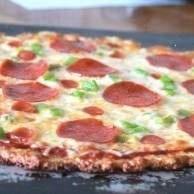 atkins pizza Easy Crispy Pizza Crust  If it means I can eat more pizza I am happy. Can't believe it uses chicken for the crust.  1 packed cup cooked, minced chicken breast  1 cup packed mozzarella, shredded  1 Tbsp parsley, dried  1 tsp basil  1/2 tsp onion powder  1/2 tsp garlic powder