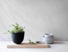 
                    
                        Even if you are running short of space for home decor elements, the Grow Pot & Cutting Board by Menu can easily fit in on a shelf or window sill.
                    
                