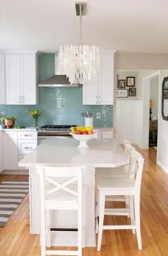 
                    
                        Love the turquoise tile backsplash, low bar, white cabinets, wood floors...a lot like your cottage Kaye Randle
                    
                