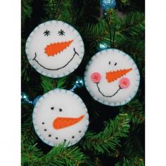 3 fun felt Christmas ornaments. Snowman faces. Christmas tree pillow. Stocking with patches.