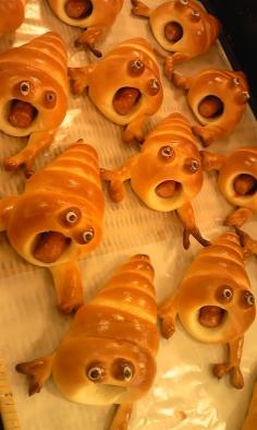 A dramatic take on "pigs in a blanket." These things look totally insane! Hot dogs or sausages wrapped inn crescent rolls.