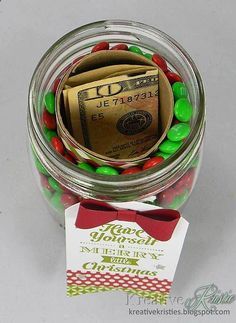 
                    
                        cover toilet paper roll, adhere and put inside mason jar. Fill around the roll with favorite candy. This is the COOLEST way ever to give money!!
                    
                