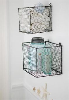 
                    
                        Bring classic vintage charm to any room in your farmhouse with our Wire Basket Box Set. There???s nothing quite as rustic as chicken wire, which farmers have been up-cycling for decades. Emblematic of rural self-reliance and practicality, these boxes will find any number of decorative and organizational uses in your home, whether fastened securely to a wall or resting on any surface. Distressed metal finish. Set of two
                    
                