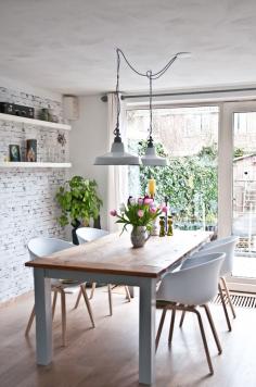 Industrial style dining area with white brick wall and industrial pendant lights. Find similar lights & more inspiration at www.FatShackVintage.com.au!