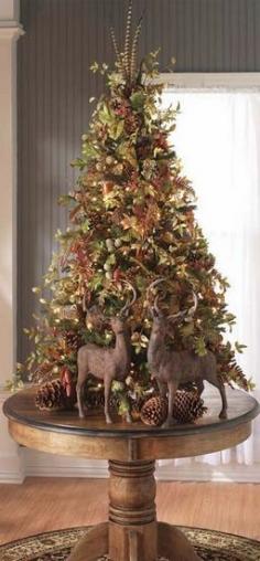 .A natural "woodsie" Christmas tree.  Love the reindeer too.