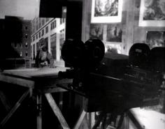 
                    
                        Ray's rear projector, the wall with his storyboard sketches and his model of the Rhedosaur. The Maestro at work.
                    
                