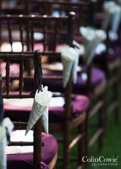 
                    
                        At the end of each row, cones made of music sheets are filled with white petals to be tossed after the ceremony. Wedding Decorations, Purple Wedding, Country Wedding
                    
                