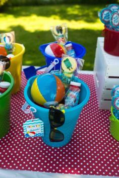 
                    
                        Mini beach balls and sunglasses are a must for this Colorful Pool Party via Kara's Party Ideas.
                    
                