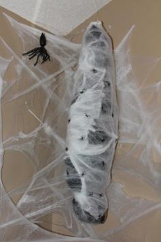 22 Creepy DIY Trash Bags Halloween Decorations put in spider web with giant spider!!