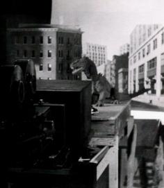 
                    
                        Here's a great shot from Mr. Harryhausen's view. The tabletop New York, with the Rhedesaur walking down the street. And his famous Rear-Projection camera. ( The Beast from 20,000 Fathoms. )
                    
                