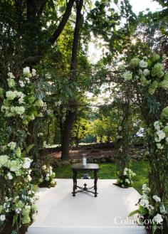 
                    
                        A lush ceremony arch covered in natural green and white hues. Wedding Decorations, Purple Wedding, Country Wedding
                    
                