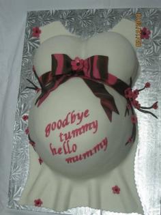 cake for a baby shower. cake is vanilla cake with strawberries and whipped cream. covered in MMF