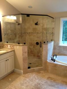 Frameless corner glass shower. dual shower heads. garden tub. tiled shower  future master bath layout.  love it.