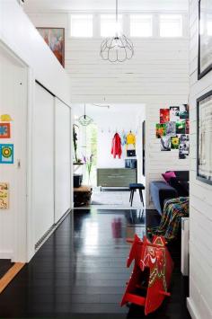 
                    
                        A happy Swedish home with black floors and bright colours
                    
                