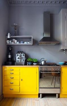 yellow kitchen cabinets + slate grey wall