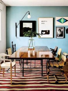 love everything about this space: the mix-matched chairs, asymmetry of the wall pictures. The rug! the wall colour! 