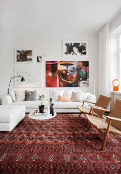 rug, white couch, colorful art