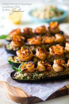 
                    
                        Paleo Lemon Asparagus Cauliflower Rice Stuffed Grilled Zucchini With Shrimp -  Cauliflower rice is mixed with vegetables and  fresh lemon, stuffed into grilled zucchini and topped with shrimp. An easy, gluten free, and healthy meal, that is under 200 calories! | Foodfaithfitness.com | Taylor | Food Faith Fitness
                    
                