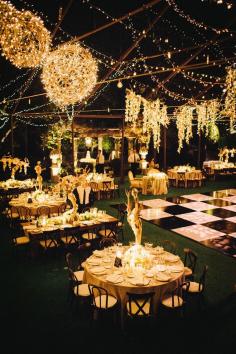 This outdoor wedding is amazing! Really a dream reception with the twinkle lights and black and white dance floor