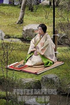 This Japanese woman wears a kimono of the Heian period as she sits by the Holy Stream at the Kamigamo Shrine ~ Kyoto, Japan.