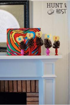 
                    
                        Pinecones in chalk painted candle sticks, for my little hearts...  www.huntandhost.com
                    
                