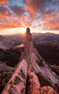 A climber stands atop Eichorn pinnacle in Yosemite national park, California. photo Grant Ordelheide