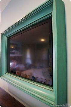 This is what I want to do with our wall mounted TV.  Super cool idea ~ a framed TV.