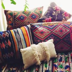Love this mix of boho pillows