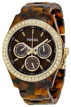A goldtone stainless steel bezel is encrusted with clear cubic zirconia stones in this stylish women's watch from Fossil. A brown dial with three subdials and a brown plastic faux tortoise bracelet finish the sharp look of this timepiece. The rich brown of the watch face against the bright sparkle of the stones creates a stunning contrast and artfully accessorizes your wrist. This reliable piece unites function and fashion in a way that makes it suitable for both formal and casual wear. Depending your outfit, this watch can easily go for an evening out or a day putting on the green. Case: Stainless steel Caseback: Stainless steel, screw-down Bezel: Goldtone stainless steel, stationary Dial: Brown Stone accents: Clear cubic zirconia stones on the bezel Hands: Goldtone, luminescent Markers: Goldtone indexes Subdials: One day, one date, one 24-hour Calendar: Day and date on subdials Bracelet: Brown plastic Clasp: Deployment Crystal: Mineral Crown: Push/pull Movement: Quartz Water resistance: 5 ATM/50 meters/165 feet Case measurements: 37mm wide x 37mm long x 10mm thick Bracelet measurements: 18mm wide x 7.5 inches long Box measurements: 3.5 inches wide x 4 inches long x 3.5 inches high Model: ES2795 All measurements are approximate and may vary slightly from the listed dimensions. Women's watch bands can be sized to fit 6.5-inch to 7.5-inch wrists. Click here to view our Watch Sizing Guide.