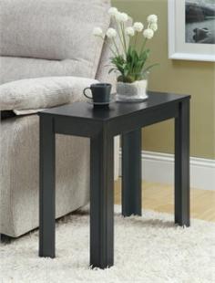 Made of oak wood. Eye-catching black finish. Solid and tapered legs with subtle details. Ample surface space for displaying decorative items. Dimensions: 23.5W x 11.75D x 21.75H in. Robust, modern style with a small footprint, the Monarch Rectangular Black Oak Wood Accent Side Table makes a designer statement in your living room. This side table is made solid oak with a handsome black finish to match any decor. About Monarch SpecialtiesWilbur Berger established Monarch Glass in 1950 on Rachel Street in Montreal, providing quality custom mirror and glasswork for both retail stores and the home. Understanding that there was more business with glass, Monarch started manufacturing and then diversified to importing mirrors and frames. Currently, the company is centered in Quebec, where it is a leader among furniture importers and distributors, focusing on fashion forward designs and impeccable customer service.