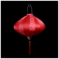 This is our new Vietnamese Silk Lantern for 2016! Made from 100% Brocade silk fabric with Jacquard weave designs stretched over a high-quality metal frame with a matching tassel below. PaperLanternStore's new premier Diamond Shaped Silk Lanterns are inspired by Vietnamese artisans and is meant to bring good fortune to you, your family, and your business. Expands like an umbrella in less than a minute and will be ready to hang and look amazing for any stage, event venue or New Year celebration. These beautiful Vietnamese lanterns, which are sometimes referred to Chinese Lanterns, are available in 3 colors and 5 sizes ranging from 13.75 inches wide x 12 inches long (w/o tassel) all the way up to 31 inches wide x 24.75 inches long (w/o tassel). This highly visible silk lantern is perfect for displaying indoors or outdoors in any party, wedding, hotel, or nightclub. Product Dimensions: Main Lantern Width: 18.25 Inches. Main Lantern Length: 15.5 Inches. Handle Length: 5.5 Inches. Tassel Length: 9.5 Inches. Overall Dimensions (Inches, Width x Length): 18.5 W x 30.5 L. Color: Red. Shape: Diamond.