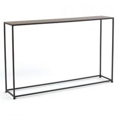 Compact design with architectural flair. Made of sturdy steel rods and steel plating. Features a slightly textured Coco finish. Sleek and eye-catching contemporary style. 8L x 40W x 29.5H inches. With its slim-line design the Tag Urban Narrow Console Table makes a perfect landing pad for narrow hallways and foyers. The Urban collection was designed with compact spaces in mind offering architectural elements on a smaller scale. This console table is constructed from sturdy solid steel rods and has a steel-plated top. The durable powder-coated finish in Coco adds slight texture. Measures 8L x 40W x 29.5H inches. No assembly is required. Other matching tables from the Urban collection are available for purchase separately. About TagFounded by NYU graduate and current owner Norman Glassberg in 1975 Tag is a leader in textiles gifts and furnishings and manufactures their products in nine different countries. With a huge variety of products available to enhance the beauty and comfort of your home Tag focuses their attention on the idea of a central look with all of their pieces - you can tell a Tag furnishing by its distinctive clean-lined style that's unlike anything else. Today Tag's main goal (aside from maintaining their unique aesthetic) is to bring you high quality affordable products you'll be proud to use and display.