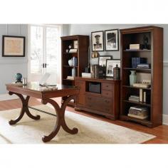 4-piece desk set with elegant design. Solid wood construction. Rustic cherry finish. Desk: center drop-down drawer and 2 side drawers. Credenza: drawers, pull-out shelf, cabinet. Rolling casters on credenza. 5 shelves on each bookcase. Even your most boring office work gets an elegant makeover with the Liberty Furniture Brookview 4 Piece Desk Set. A great way to furnish your new home office or renovate an old one, this four-piece set comes complete with a desk, credenza, and two five-shelf bookcases, all finished in a rustic cherry. The desk features a center drop-down front and two side drawers, while the credenza has a bottom lateral file drawer, two storage drawers, a pull-out printer shelf, and a side cabinet with an adjustable interior shelf. Locking casters on the credenza are handy, too. Dimensions: Writing desk: 54W x 30D x 13H in. Credenza: 53W x 22D x 32H in. Bookcase: 30W x 15D x 72H in. About Liberty FurnitureEstablished in 1993, Liberty Furniture Industries, Inc. had seven employees and manufactured wood chairs and laminate table tops in a modest section of a warehouse in west Atlanta. Over the years, its scope has widened to include formal and casual dining furniture, accent furniture, and bedroom furniture. It now operates out of three main facilities in Atlanta, one brand-new facility in Chicago, and its first Asian office. As Liberty continues to grow, it searches for more ways to expand and offer more of what its customers want. Liberty is now one of the premier leaders in manufacturing and delivering quality furniture at exceptional value. Through its growth, it has remained a strong, family-oriented business that never compromises its values of dedicated customer service, a relentless pursuit of quality, and a devotion to enriching lives of its employees, its customers, and its community.