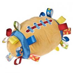 Mary Meyer Taggies Plush Touchdown Football Huddle, hike, pass and snuggle. Soft, playful and sure to ignite imaginations, our football blanket will score with that precious little quarterback. Full of bright, colorful and themed tags, this multi textured, shaped Taggies is ready for winning touchdowns. Patented Taggies are based on the idea that babies and kids love to rub satin edges. Taggies offers items for a child's positive social and emotional development, that will transition and stay with them through the continuing phases of healthy growth. This Taggies is brought to you by Mary Meyer Toys. Mary Meyer has been making toys that are safe and fun for more than 75 years. In 1933, 29 year old Mary and her husband, Hans Meyer, put their talents together to design, manufacture, and sell animal pin cushions and with dolls. After several years they added stuffed toys. In the early 1940's, they moved the company to the beautiful Green Mountains of Vermont. In the mid 1950's Mary's son Walter joined the company. In 1982 Walter's son, Kevin, joined the company, eventually becoming president in 1986. Mary was active in the management of her business until 1982, retiring at the age of 78. After her retirement, she continued to be involved with the company. Through her 80s and into her 90s, she spent many hours in the company factory store. She loved to visit with teddy bear collectors and sign their Mary Meyer collector bears. Mary Meyer died in 1999 at 94 years of age. Known as Gram to family, friends, townspeople, employees and colleagues worldwide, Mary brought a sense of gentleness and graciousness to the toy industry. Fortunately, Mary's influence lives on. You can see it in over 400 different stuffed toy designs we offer. Following Mary's principles, we continually strive to design extraordinary products of outstanding quality, all the while keeping an eye on customer service and value.