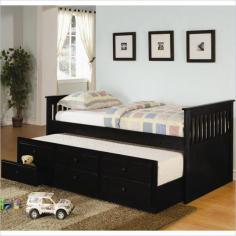 Includes trundle and storage drawers. Twin bed. 80.38 in. L x 42.38 in. W x 36.25 in. H. Made from solid wood. Simple slatted ends. Casual style. Three spacious storage drawers below the trundle offer lots of space for clothing and extra linens. Trundle can accommodate a mattress with max height of 8 in. Drawers: 19.5 in. L x 19 in. D x 4 in. H. Trundle rolls out on wheels and is not attached to the bed. Warranty This classic captain's bed will be a wonderful addition to the youth bedroom or spare room in your home. This piece can provide a comfortable place to lounge during the day, and cozy spot to sleep at night. A convenient trundle below allows you to easily accommodate overnight guests, pulling out simply to provide an extra twin size sleeping space.