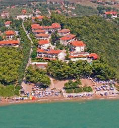 This magnificent resort, located right on the beach and surrounded by a beautiful blossom garden, offers its guests a perfect place to enjoy a unique holiday experience. The hotel is situated in Nea Potidea, a tourist town in Chalkidiki, where travellers can find numerous restaurants, bars and other entertainment venues. After spending the day on the beach, guests might relax in the beautiful and bright rooms, which are all tastefully decorated with comfortable furniture and offer modern facilities to provide and enjoyable stay. Some of the rooms feature a private balcony with a stunning view over the sea. Those who stay in this hotel may taste fantastic international cuisine as well as authentic Greek specialities in the on-site restaurant. On those warm summer days, visitors may take advantage of the sparkling outdoor pool and enjoy a moment of relaxation on the sun loungers.