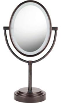 Do your morning routine with the assistance of the Conair Oval Double-Sided Lighted Mirror. This mirror is perfect for use in your bathroom or on your vanity and gives you a double-sided design that makes it great for a variety of uses. Use the standard side for quickly checking your reflection and switch to the 7x magnification while doing makeup or shaving. The easy 360-degree rotation lets you switch between magnifications as often as you need. The mirror also includes circular lighting and Picture Perfect reflection glass, offering you a crystal-clear, fog-free reflection. The oiled bronze finish makes the mirror an elegant touch for any room, while the 5 foot cord lets you easily place the mirror wherever it works best for you.