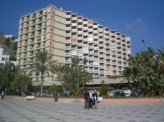 This apartcomplex is set on the beachfront in the holiday resort of Almuñecar, a 10-minute walk from its centre where one can find a range of shops, restaurants and bars. The venue is a great choice for a family vacation or for those who enjoy little more independence during their holidays. All of the apartments come with simple, but pleasant decor, marble floors and well-equipped kitchenettes ideal for preparing some delicious snacks. Those who prefer someone else to take care of the meals will be at the right place at the onsite restaurant, where they cannot just try delicious local, but also international and other specialities. After the hearty meal there is hardly anything better than a nap on the sun loungers around the outdoor pool, and when the weather gets too warm one can always grab a chilled drink from the pool-side bar to restore the balance.