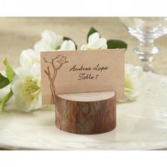 In a forest. On a farm. In a vineyard. Here's the charm. When it's all about trees and nature, only real wood will do. This stunningly simple, real-wood place card/photo holder adds to the beauty of any setting where family, friends and the beauty of nature are gathered. Circular, real-wood place card/photo holder with visible age circles and a slit on the top for place card or photo. Though sizes vary slightly, place card holder measures approximately 1in. h x 1 3/4in. in diameter. Insert Measures: 2in. h x 2 3/4in. w. Coordinated place cards included. Sold in a set of 24. Ground shipping is available for this item (Expedited shipping is not available). *Sorry, we are unable to ship this product to HI, AK, AE, Guam, Canada or Puerto Rico