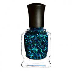 Shade: blazing blue and metallic green glitter in highly sheer navy base Deborah Lippmann's nail lacquers are made with the finest ingredients, offering gorgeous color as well as treatment benefits. Formulated with Biotin, green tea and Aucoumea Klaineana extract theses nail colors helps to strengthen, hydrate, stimulate nail growth and prevent ridge formation. Slightly thicker in consistency than ordinary nail color and brush bristles that are more densely packed allow color to glide on evenly and effortlessly. Benefits: Botanical ingredients strengthen, hydrate, promote nail growth and deter ridge formation. Quick-drying, long-wearing and highly pigmented. Free of formaldehyde, toluene, dibutyl phthalates, camphor and formaldehyde resin. Note: Polish bottles should kept in an upright position. Laying the bottle down causes it to separate much faster and breaks down the formula.