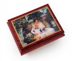 This radiant Ercolano music box will bring joy to your loved one for years to come! This hand-crafted wonder features an authentic replication of the painting "A Time Together " by American artist, Sandra Kuck, The lovingly nostalgic painting portrays a young mother and her precious daughter celebrating the day in a lovely garden. The music box is stained in beautiful red wine finish and is constructed on natural burl-walnut. This treat for the eyes is all complimented by the wonders of sound with a precision mechanical movement, sure to bright anyone's day. With over 380+ tunes available, you're sure to find that perfect melody. Please see "item options" for available tunes or visit our "listening station" for all song titles as well as sample clips. Thank you very much for your interest in our products! Your satisfaction is always guaranteed at the Attic! Dimensions: Length - 6.75" Width - 4.5" Height - 2.5