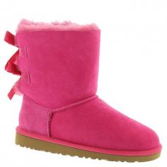 UGG AustraliaKids' Bailey Boot with Bow, Cerise, 13T-4YDetailsUgg monogrammed Bailey boot. Twin-faced black brush-dyed sheepskin or single-face sheepskin with dyed shearling (Australia), 100% UGGpure wool, or mixed shearling and UGGpure wool lining. If desired, personalize with one or three initials in your choice of styles shown. Logo-engraved wooden button and loop detail at top of shaft. Suede heel guards. Molded EVA sole for traction. Wear barefoot to maximize benefits of plush genuine grade A sheepskin or single-face sheepskin in a wide variety of temperatures. Imported. Please Note: This item is not available in stores. Monogramming takes 2-4 weeks. Orders for monogrammed items cannot be canceled, and monogrammed items cannot be returned. The monogram preview feature displays fabric color (not pattern), thread color, monogram style, and selected initials. Designer About UGG Australia: When an Australian surfer visited the U.S. in 1978 and brought his home country's sheepskin boots with him, the idea for UGG Australia was born. With comfort and luxury as its two watchwords, UGG Australia soon built a stellar reputation in both categories. Beyond the well-known sheepskin boots spotted on a who's who-list of Hollywood stars, UGG Australia also features styles such as knit boots, shearling slippers, and leather hiking boots for men and women. Plus, there's a children's collection with wee sheepskin boots and even Mary Jane-style walking shoes.