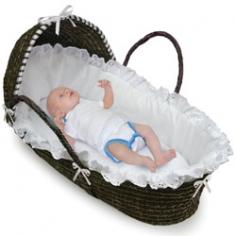 This pretty Moses Basket creates a space for Baby anywhere in the house! A safe place for your baby to sleep at home or when visiting friends. Keep Baby close by wherever you are! Overall unit measures 30 inches L x 17 inches W x 18 inches H. Basket is 6 inches deep in the middle. Soft liner is made with crisp, white 65% polyester/35% cotton fabric trimmed with a white ruffle. Soft 100% polyester fill pads the liner for comfort. Liner is removable and can be machine washed cold and tumbled dry low. Includes a polyurethane foam mattress pad with a wipe-clean, PEVA (non-PVC) vinyl cover. Also includes one, white, 65% polyester/35% cotton fitted sheet. Additional sheets sold separately. Basket hood shades your baby, or it can be removed completely. Hood attaches with Velcro&#0174;. Basket can be used until Baby is approximately 15 pounds (6.8 kg) or until Baby can push up or roll over unassisted. Basket should always be placed on a firm, flat surface. Never place it near the fireplace or open flames. Sturdy, 8 inch high handles are woven onto the basket. The handle is actually inches one piece" that goes down both sides and under the bottom. Although this basket includes handles, we do not recommend carrying the basket with your baby in it for safety reasons. When Baby outgrows the Moses Basket, use it as a place for storing stuffed animals or linens, or as a bed for dolls or pets. Product may vary slightly from shown. All measurements approximate. Complies with all current, applicable ASTM safety standards. Simple assembly required to attach the hood and liner; no tools required, illustrated instructions included. Mattress pad is manufactured with the maximum thickness allowable under current safety standards.