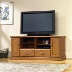 SAU1323: Features: -Holds TV weighing 240 lbs or less-Two adjustable shelves hold audio and video equipment-Made in USA. Color/Finish: -Carolina Oak finish. Specifications: -Storage area behind doors has an adjustable shelf and holds 68 DVDs and 88 CDs. Collection: -Orchard Hills collection. Warranty: -Manufacturer provides 5 year warranty.