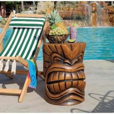 Faux wood grain designer resin. Tiki head side table is perfect for cocktails. Carved details and faux wood finish. Dimensions: 15.5 diam. x 20.5H inches. Sun, surf, and fruity drinks make the Tiki gods happy, and you can get happy right along with them by adding the Grand Tiki Teeth Sculptural Table to your poolside decor. Made of a faux wood grain resin, this table is sturdy, fun, and full of Tiki charm. About Design Toscano: Design Toscano is the country's premier source for statues and other historical and antique replicas, which are available through our catalog and website. We were named in Inc. magazine's list of the 500 fastest growing privately-held companies for three consecutive years - an honor unprecedented among catalogers. Our founders, Michael and Marilyn Stopka, created Design Toscano in 1990. While on a trip to Paris, the Stopkas first saw the marvelous carvings of gargoyles and water spouts at the Notre Dame Cathedral. Inspired by the beauty and mystery of these pieces, they decided to introduce the world of medieval gargoyles to America in 1993. On a later trip to Albi, France, the Stopkas had the pleasure of being exposed to the world of Jacquard tapestries that they added quickly to the growing catalog. Since then, our product line has grown to include Egyptian, Medieval and other period pieces that are now among the current favorites of Design Toscano customers, along with an extensive collection of garden fountains, statuary, authentic canvas replicas of oil painting masterpieces, and other antique art reproductions. At Design Toscano, we pride ourselves on attention to detail by traveling directly to the source for all historical replicas. Over 90% of our catalog offerings are exclusive to the Design Toscano brand, allowing us to present unusual decorative items unavailable elsewhere. Our attention to detail extends throughout the company, especially in the areas of customer service and shipping.