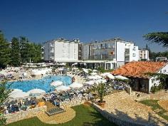 This family-friendly beach resort is situated in the pleasant shade of a pine tree park. It lies within 100 metres of the sea and is just a 10-minute walk from the picturesque old town of Porec, where guests will find a number of attractions. The establishment's immediate vicinity is home to restaurants, bars, pubs, shops and public transport links. Pula is approximately 60km away. This is the ideal place for a holiday for families with children and anyone after an active holiday. The air-conditioned establishment was renovated in 2008 and comprises a total of 170 guest rooms and suites spread across 3 storeys. The spa complex welcomes its guests into a lobby with 24-hour reception and check-out service, a hotel safe and currency exchange facilities. On-site facilities include lift access, a newspaper stand, a hairdressing salon, a children's playground and a kids' club. Dining options such as a café, bar and restaurant are available, and business guests will appreciate the conference facilities and WLAN Internet access (fees apply). Additional fees apply for the room and laundry services, and guests arriving by car can leave their vehicles in the nearby car park. Those wishing to explore the local surroundings can hire bikes from reception for a fee. These comfortable, modern rooms will give guests the peace that they desire, while the beautiful views of the dense, fragrant pine forest and the crystal-clear blue sea will put a smile on their faces. Guests can wake up to the sound of birdsong and bask in the sun on their balconies, whilst enjoying the unforgettable views. The en suite bathrooms come with a shower and hairdryer, and the rooms themselves feature double beds, a direct dial telephone, satellite/cable TV and air conditioning.